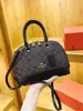 Bolso de Hombro Vintage Nueva Moda Otoño/Invierno 2026 para Mujer con Monograma Bolso Versátil Estilo Europeo y Americano Forma de Concha Personalidad Única