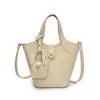 2026 Estilo Coreano Verão Pequeno Nicho Simples Casual Bolsa de Mão Estilo Balde Bolsa Transversal de Ombro com Textura de Alta Qualidade Bolsa Feminina Tendência