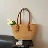 Bolsa tejida de estilo nuevo para la primavera de 2026, bolsa de playa de paja, de un solo hombro, estilo vacacional pastoral francés, bolsa grande para mujer