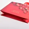 Bolsas de cartón blanco personalizadas para tiendas de ropa, ópticas, bolsas para empaque de cosméticos, bolsas de regalo y bolsos al por mayor personalizados