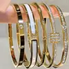 Conjunto de Pulseras de Acero Inoxidable Doradas Transfronterizas con Clavos de Diamante Pulsera de Trébol de Cuatro Hojas Cintura Pequeña Brazaletes Dorados