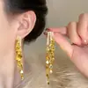Aretes de Borla de Hoja de Oro Dorado para Mujer Otoño e Invierno 2025 Nuevos Aretes Explosivos Retro Lujo Ligero Aretes de Alta Gama