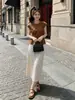 Conjunto elegante de dos piezas: top de camisa de manga corta con nudo retorcido y abertura en el dobladillo estilo coreano de moda de verano y falda de lunares