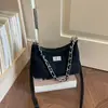 Bolsa Versátil de Outono Nicho Elegante Feminina Transversal Super Quente 2026 Nova Moda Ombro Único Popular Sob o Braço