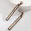 Los Pendientes Largos Exagerados Retro Más Vendidos de Amazon para Mujer de Aleación Incrustados con Turquesa Blanca Redonda de Nicho Pendientes de Alta Calidad