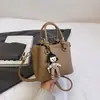 Promoção Quente Primavera e Verão Bolsa de Mão Simples Cor Sólida Textura de Pedrinhas Estilo Comuter Feminino Bolsa Transversal Casual para Ombro