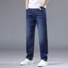 Calça Jeans Lavada Azul de Alta Qualidade Transfronteiriça Masculina Nova para Primavera e Outono Jeans Reto Solto Casual Elástico Calça Longa Meninos