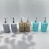B&B de Alta Qualidade Redondo PP Padrão de Fluxo Três Cores Frasco de Loção Prateado de Alto Padrão Pressão para Frasco de Shampoo e Gel de Banho