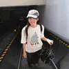 Camiseta blanca de algodón puro de manga corta para mujer, nuevo estilo popular verano 2026, diseño holgado para estudiantes, top único y extremadamente elegante