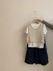 Conjunto de 3 piezas de moda versátil para niñas, estilo coreano, manga corta, verano 2026, chaleco calado de color liso con pantalones largos