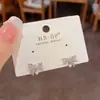 Pendientes Exquisitos de Moda Japoneses Coreanos con Pequeño Circonita Perla Lazo para Mujer Elegantes de Lujo Ligero Versátiles Super Brillantes Venta al por Mayor