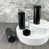 Fornecimento direto da fábrica 32 dentes 60ml frasco cilíndrico reto preto tampa de pó pó para brotoeja talco pó secante frasco de HDPE