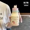Nuevo termo de dibujos animados lindo jarrito de leche, taza de estudiante de alta estética con pajilla, taza de agua compacta portátil de dibujos animados con asa