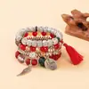 Pulsera de brazalete con colgante de borla de ala redonda estilo bohemio transfronterizo europeo y americano, pulsera de cuentas con cordón elástico multicapa