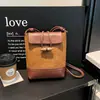 Bolsa Suede Nicho Retrô Outono e Inverno Feminina 2026 Nova Versátil Bolsa Transversal Bolsa de Mão Balde Estampa de Leopardo
