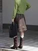 Falda midi de cuero lisa y versátil de Feiyuan con volantes para mujer, nueva falda elegante de línea A para commuting de principios de otoño