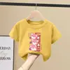 Roupa Infantil Feminina Verão 2026 Estilo Cartoon Nova Elegante Manga Curta 100% Algodão Puro Camiseta Infantil Feminina Manga Meia-Manga Roupa de Verão