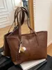 Bolso de mano grande de cuero encerado para mujer, nuevo bolso de hombro de moda 2025, bolso de mensajero elegante y versátil