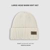 Gorro de punto grueso para mujer, estilo coreano, de otoño e invierno, con etiqueta de cuero y letras, de lana, con cabeza grande, cálido, con protección para las orejas, para hombre.