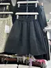 Falda midi de lana mezclada, minimalista y a la moda, con adornos de pedrería, estilo coreano, para mujer, colección otoño 2026, corte holgado, falda versátil de retazos en línea A