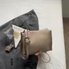 Bolso tipo caja de lujo nicho 2026 con patrón de lichi texturizado, nuevo bolso cuadrado pequeño versátil de moda con cierre, bolso de hombro y cruzado