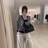 Contiene 4% lana y 11% pelo de conejo, suéter vintage a rayas suelto con cuello en V para mujer de Guangzhou Trece Líneas imis*2026 otoño/invierno
