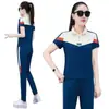 Traje deportivo de manga corta con cuello alto para mujer 2026 estilo nuevo de verano, talla grande, holgado y adelgazante, conjunto de dos piezas con pantalones largos