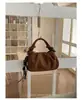 La popular bolsa de ante tipo dumpling para mujer de este año es el nuevo bolso de hombro simple de moda 2026, un bolso cruzado de estilo coreano de nicho