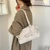 Bolso de mano estilo coreano, bolso tipo cubo, nuevo modelo 2026, bolso de hombro minimalista popular retro de color liso, bolso para el antebrazo de uso diario, venta al por mayor