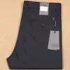22 Primavera Nuevo algodón mercerizado nailon elástico pantalones de hombre verano finos rectos frescos seda de hielo pantalones casuales de negocios para hombre