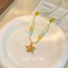 Collar de cuentas de estrella de mar con perlas de verano de color naranja, diseño de nicho, joyería de cadena de clavícula para mujer de alta calidad y exquisita moda.