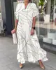 2023 nueva camisa larga casual de rayas estampadas dividida suelta para mujer de primavera y verano
