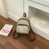 Bolsa feminina estilosa e moderna com textura única, nova coleção 2026, cor sólida simples, mini mochila de viagem casual e fashion