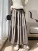 Saia feminina de tricô macia e confortável 2026 primavera e outono, de corte A soltinho estilo bolo, saia casual e que afina, de comprimento médio