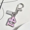 Nuevo Colgante Metálico Rosa Plateado Forma de Corazón Botella de Perfume de Cereza Llavero Accesorio Versátil para Bolsa Venta al por Mayor Dropshipping
