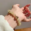Pulsera de Cristal Optimizada con Cuentas de Piedra Ojo de Gato Natural 2026 Nueva Moda Pulsera Versátil Joyería de Mano de Nicho de Alta Gama