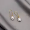 Pendientes de perla minimalistas de lujo estilo Ins Moda europea y americana de moda Perla de concha aleación de perla Venta caliente transfronteriza Temu