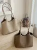 Bolso de cubo tejido de alta gama para mujer, nuevo diseño de moda trendy de nicho 2026, popular este año, bolso de hombro, bolso para el trabajo