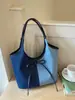 Bolso tote de gran capacidad para mujer, nuevo modelo de verano 2025, bolso simple casual para el hombro estilo ins, bolso versátil de moda para mujer