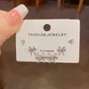 Moda coreana y japonesa Lujo ligero Versátil Lazo Conjunto de tres piezas Pendientes Delicados y compactos Diseño minimalista Pendientes para mujer