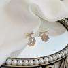 Nuevo estilo cruz de diamantes completa flor pequeña aretes de botón de diamantes para mujer Corea del Sur estilo simple frío moda aretes de aguja de plata S925