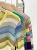 Cardigan de tricô listrado colorido novo de primavera, design de nicho com senso de estilo ocidental moderno, manga longa, decote em V, top slim para mulheres