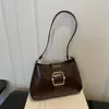 Bolso de hombro tipo baguette brillante nuevo 2026, diseño de hebilla simple y elegante, bolso de hombro de color liso, estilo coreano, versátil y elegante para ir al trabajo