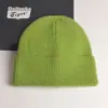 2022 nuevo gorro de punto con volantes de color liso para mujer, gorro de invierno de otoño e invierno, gorro de lana cálido de comercio exterior, combina con todo