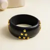 Pulsera de madera y metal con remaches y ratán de estilo étnico europeo y americano, pulsera de muñeca vintage de nicho transfronteriza, joyería de moda personalizada para mujer