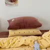 Juego de cuatro piezas de terciopelo de leche de alto gramaje color crema estilo retro para otoño e invierno, juego de tres piezas de sábana y funda de edredón de franela engrosada y cálida