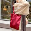 Bolso de hombro de satén perlado con textura de alta calidad, diseño de nicho, bolso de lona para mujer, bolso de mano de gran capacidad, novedad de 2024