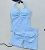 Conjunto deportivo de 2 piezas sin costuras para exteriores con top push-up acolchado de cuello halter y shorts de fitness plisados que realzan los glúteos para mujer