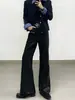 Pantalones casuales acampanados de cuero PU de alta gama, diseño de moda punk deconstruido de nicho para hombre, pantalones largos elegantes y modernos