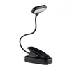 Luminária de mesa portátil com clipe LED para estudantes, ideal para leitura em dormitórios. Funciona com bateria 3A, é compacta, fácil de usar e recarregável via USB.